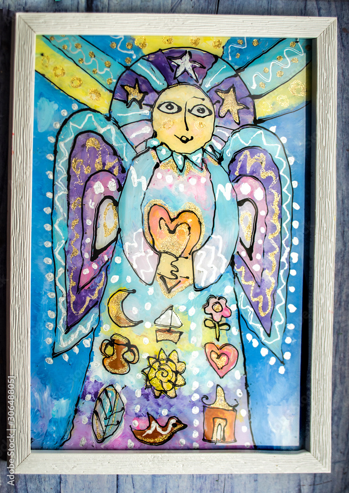 Angel with heart in hands on landscape backgroundPainting on glass.