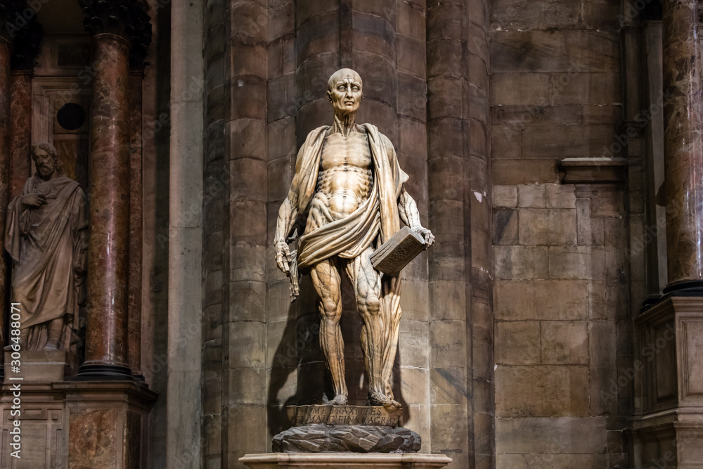Milan, Italy - March 8, 2019: Statue of St. Bartholomew Flayed was one of 12 Apostles and an early Christian martyr that was skinned in the Duomo di Milano, Milan cathedral, Sculpture
