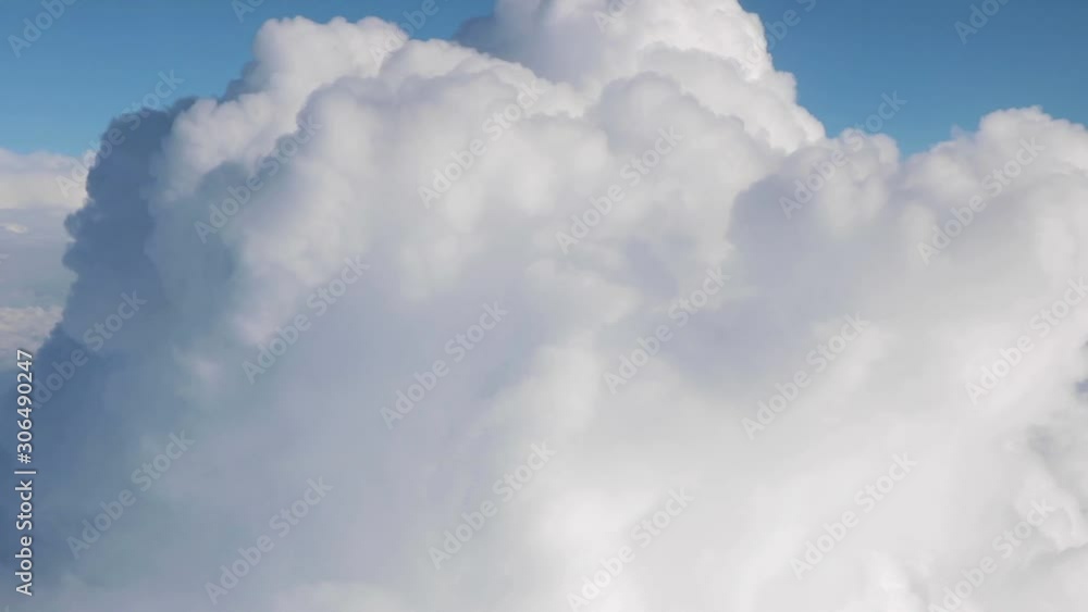 Passing by a large cumulus cloud — Aerial. Passing by a large cumulus cloud — Aerial.