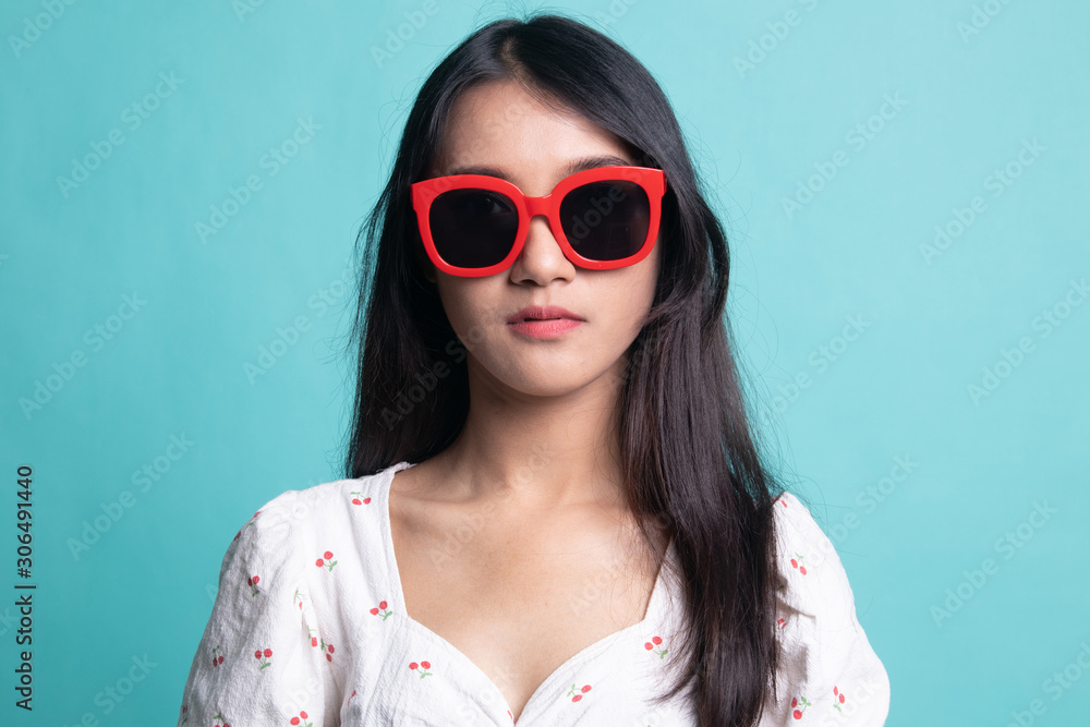 Portrait of a beautiful young asian girl in sunglasses Portrait of a beautiful young asian girl in sunglasses