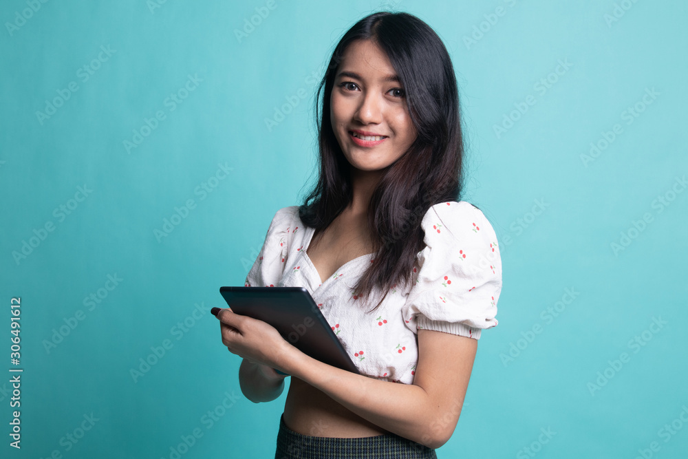 Young Asian woman with a computer tablet Young Asian woman with a computer tablet