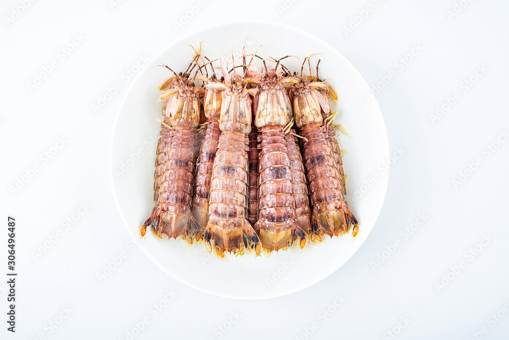Delicious steamed crusty shrimp on a plate on white background Delicious steamed crusty shrimp on a plate on white background