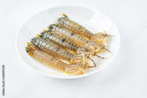 Fresh pip shrimp on a plate on white background
