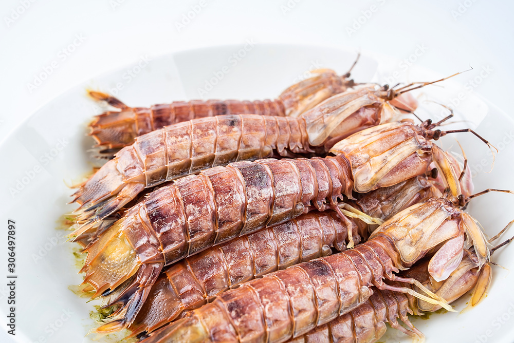 Delicious steamed crusty shrimp on a plate on white background Delicious steamed crusty shrimp on a plate on white background