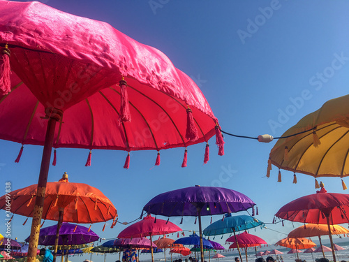 Colourful umbrellas on the beach of Bali, Kuta for people enjoying sunset and  appetizer time