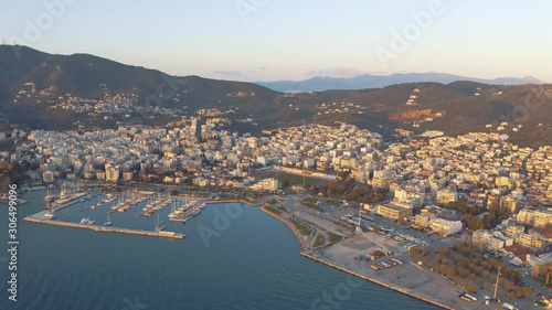 mitilini aerial drone flight over harbor at sea with marina, houses, hills, mytilene lesvos, greece photo