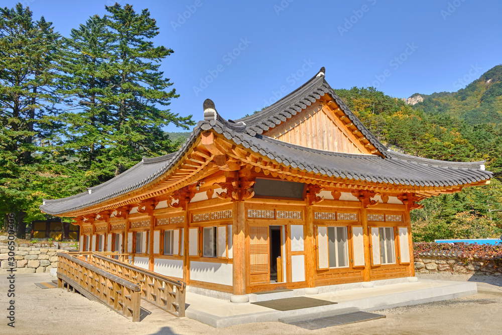 Scenic view of traditional asian or korean style building in Sinheungsa buddhistic monastery in mountains of Dinosaur Ridge in Seoraksan national park near Sokcho in South Korea.