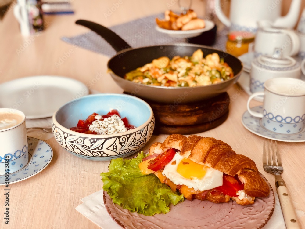 breakfast on the table. Croissant.