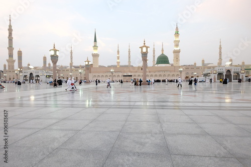 Muslim pilgrims visiting the beautiful Nabawi Mosque, The view of the retractable roof An Nabawi Mosque. photo