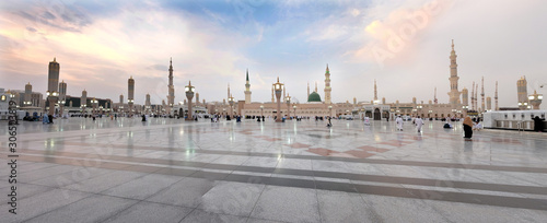 Muslim pilgrims visiting the beautiful Nabawi Mosque, The view of the retractable roof An Nabawi Mosque. photo
