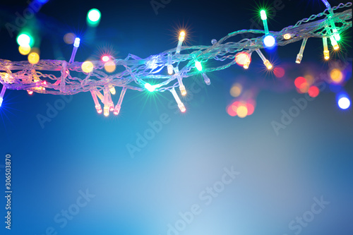Fototapeta Naklejka Na Ścianę i Meble -  Beautiful background with Christmas light garland with copy space. Holidays concept. 