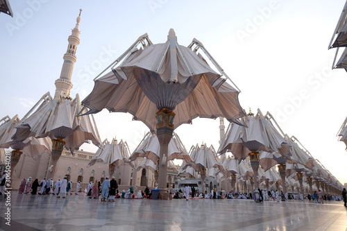 AL MADINAH , SAUDI ARABIA-1 September 2018: Muslim pilgrims visiting the beautiful Nabawi Mosque, The view of the retractable roof An Nabawi Mosque. photo
