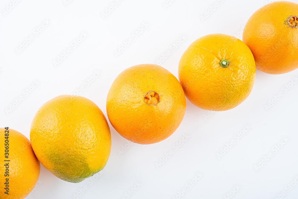 Row of fresh Gannan navel oranges on white background Row of fresh Gannan navel oranges on white background
