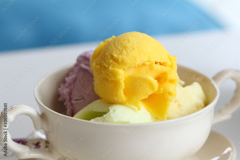 Mixed flavor ice cream scoops in bowl Mixed flavor ice cream scoops in bowl