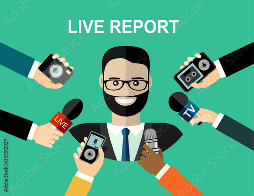 Business man giving an interview in the presence of journalists with microphones.