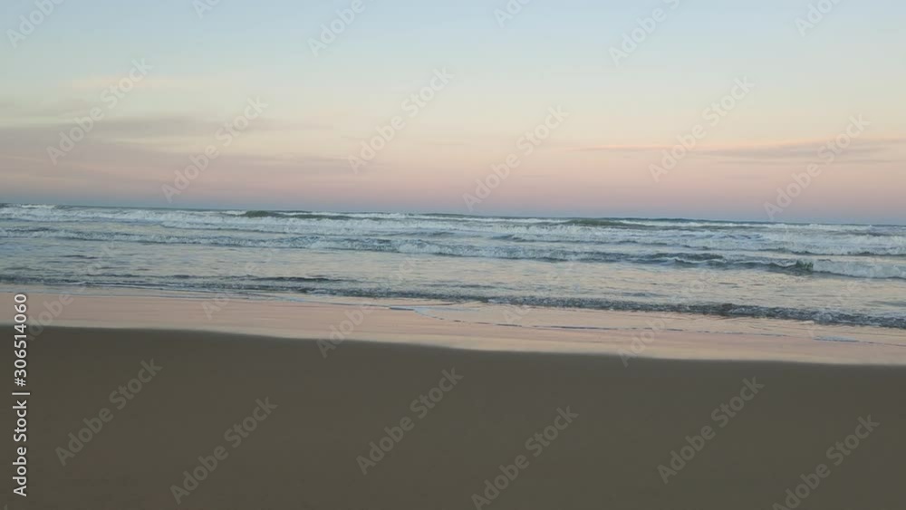 a sunset at the seashore on a beach on the coast a sunset at the seashore on a beach on the coast