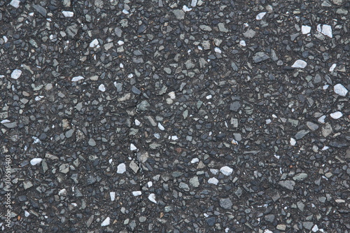 Asphalt road surface with a mixture of gray and white