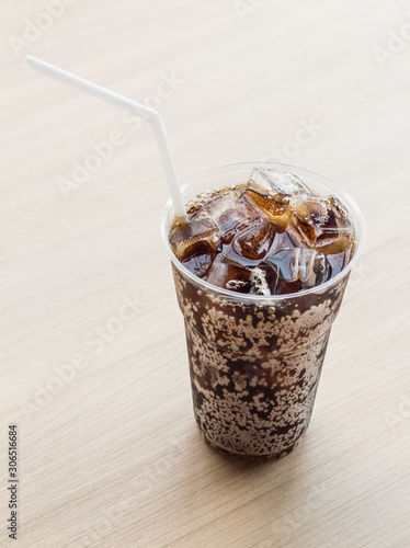 Glass of fresh cola with ice