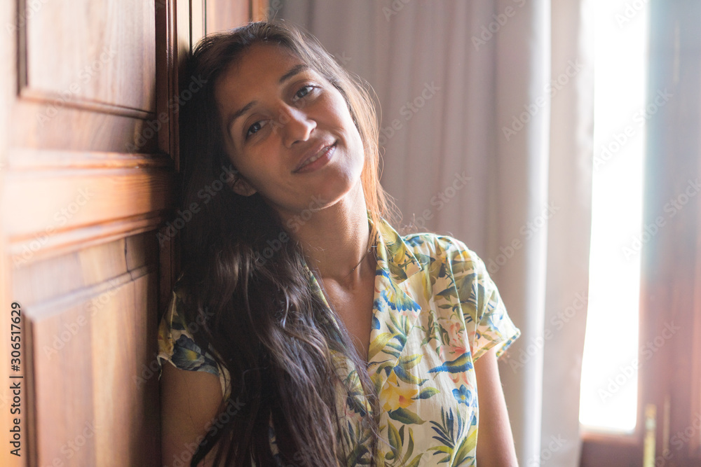 Young indian woman happy in bedroom