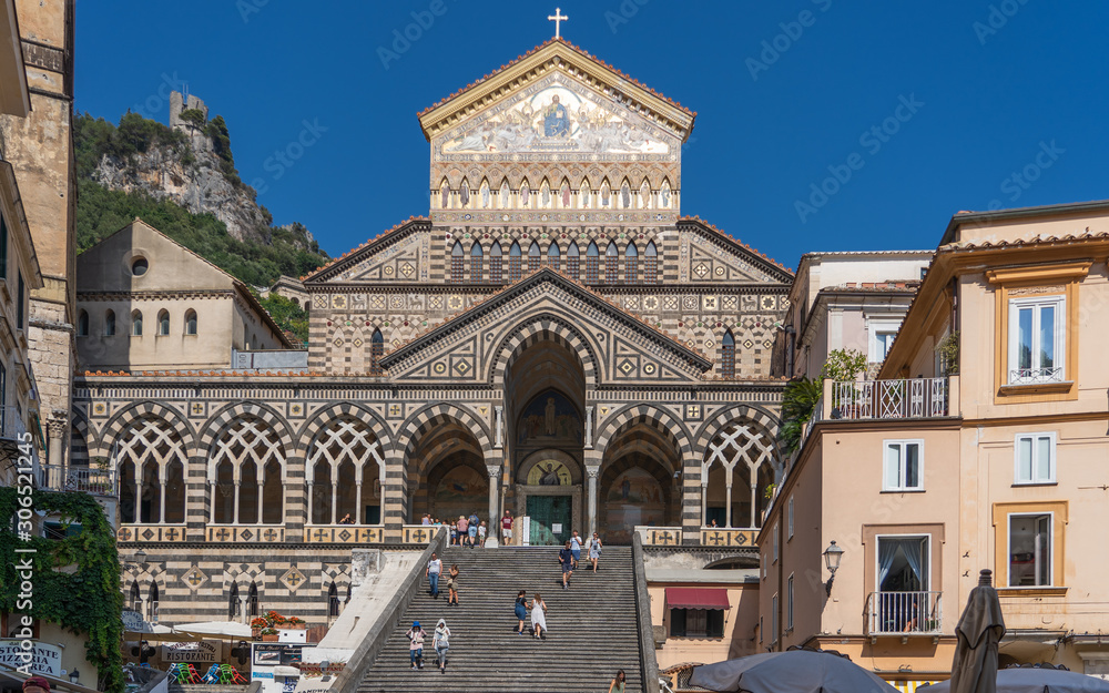 Positano, Italy - August 12, 2019: Tourists walk on the stairs of Amalfi Cathedral in summer time