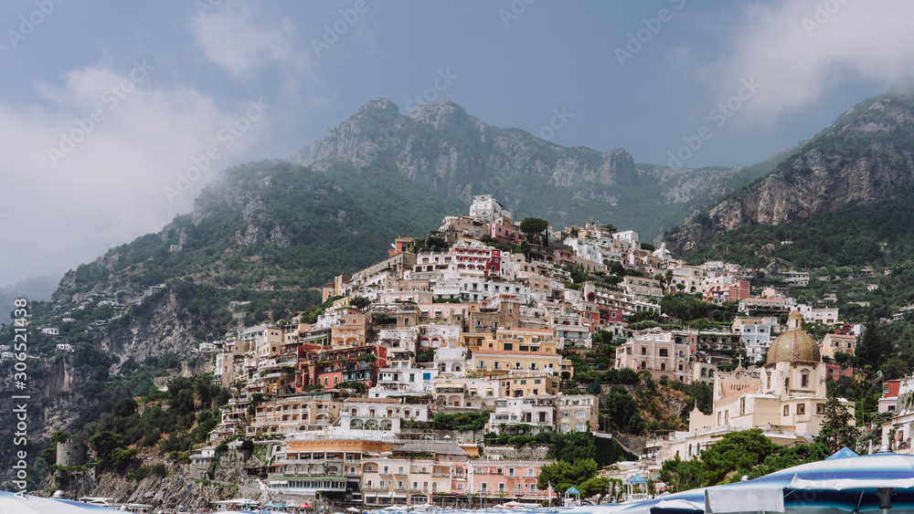 Monte San Michele with morning fog and Positano Village in Amalfi Coast in Italy