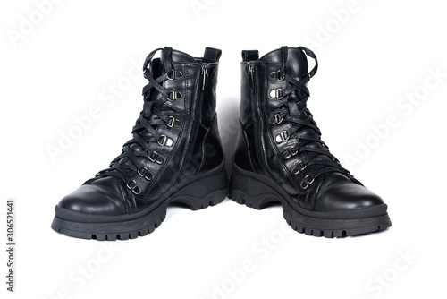 Black leather boots for the cold season on a white background, waterproof
