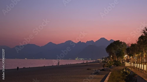 Night Time Lapse On The Beach Of Antalyan Surrounded By Mountains photo