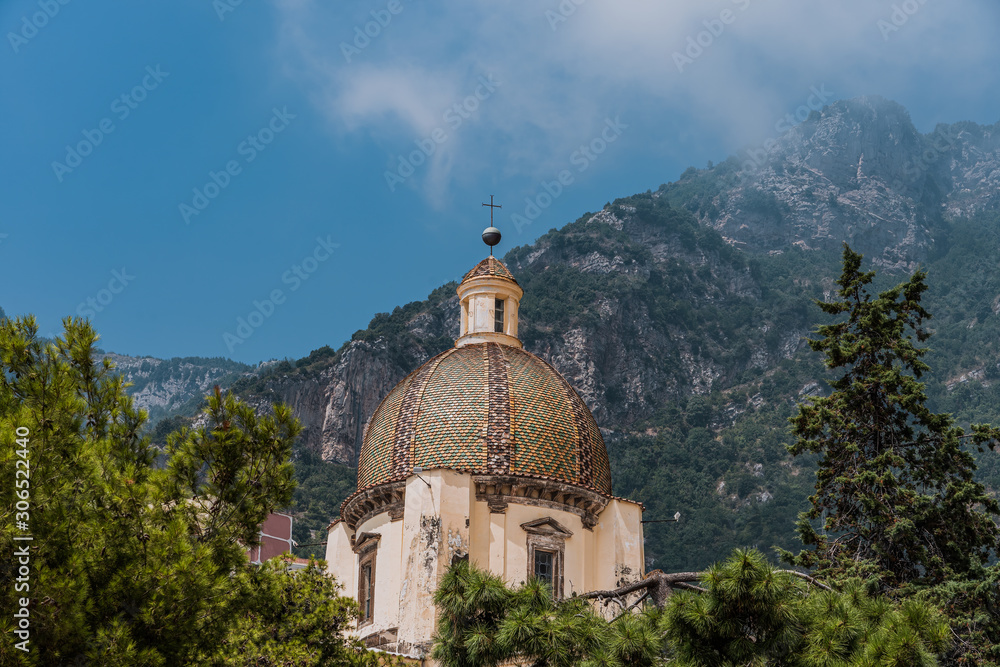 Beautiful church dome with background of Monte San Michele