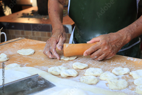chef preparing dough in kitchen