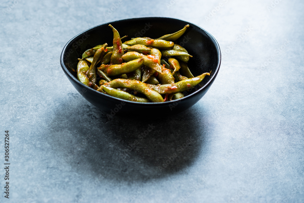 Spicy Sambal Edamame with Chopsticks / Spiced Style with Red Hot Chili Sauce.