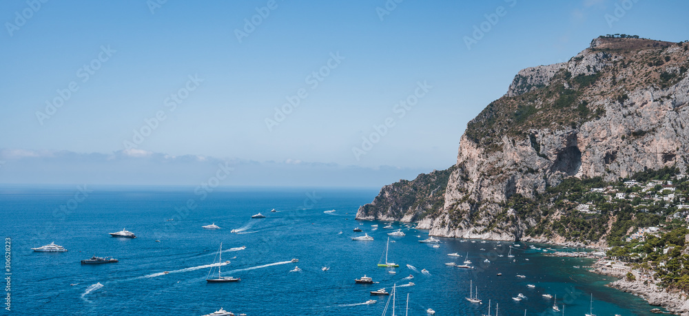 Panoramic view of south Capri Island crag coastline in summer time