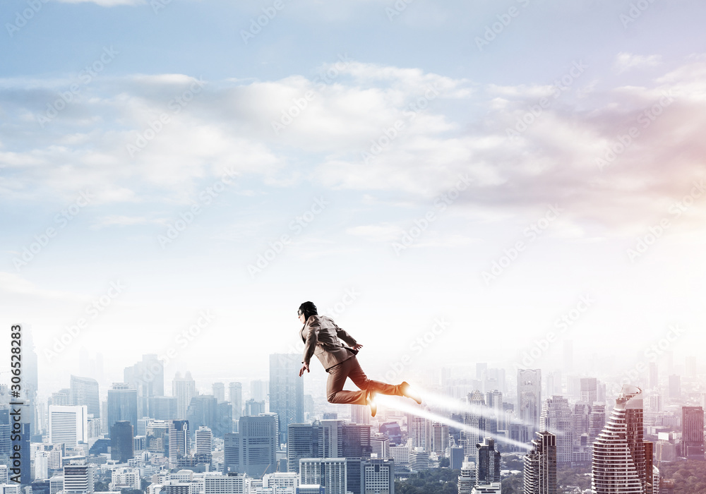 Businessman in suit and aviator hat flying in sky Businessman in suit and aviator hat flying in sky
