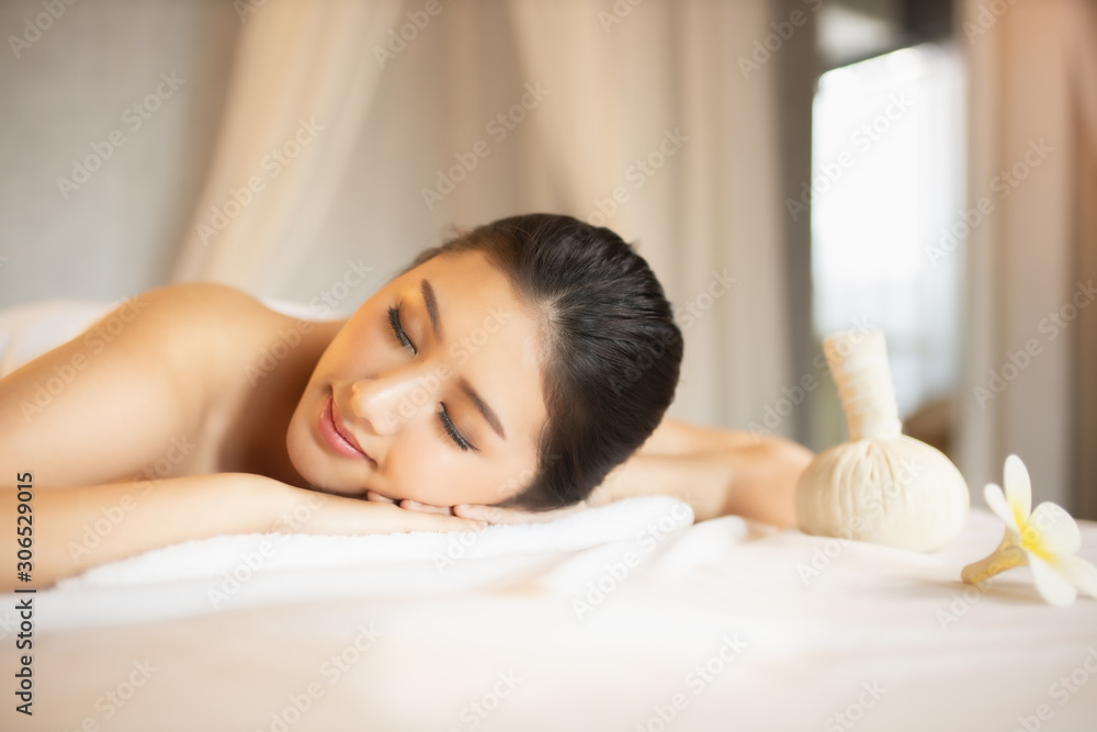 Asian Beautiful, young and healthy woman in spa salon. Massage treatment spa room . Traditional medicine and healing concept. Asian Beautiful, young and healthy woman in spa salon. Massage treatment spa room . Traditional medicine and healing concept.