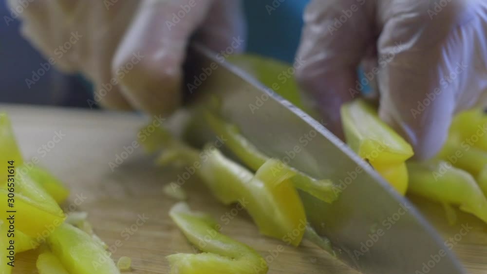 Paella event catering with a healthy choice chef cuts yellow pepper Paella event catering with a healthy choice chef cuts yellow pepper