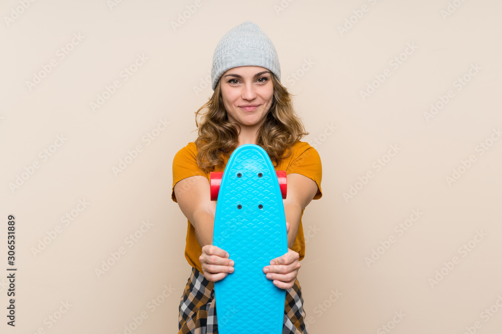 Young skater blonde girl over isolated background with happy expression Young skater blonde girl over isolated background with happy expression