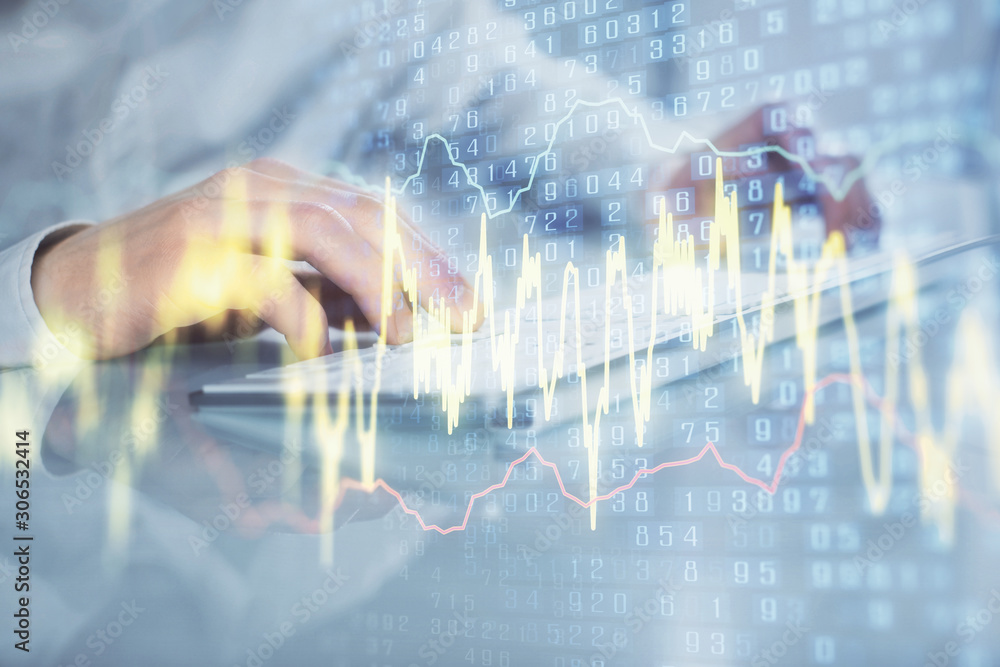 Double exposure of graph with man typing on computer in office on background. Concept of hard work. Closeup. Double exposure of graph with man typing on computer in office on background. Concept of hard work. Closeup.