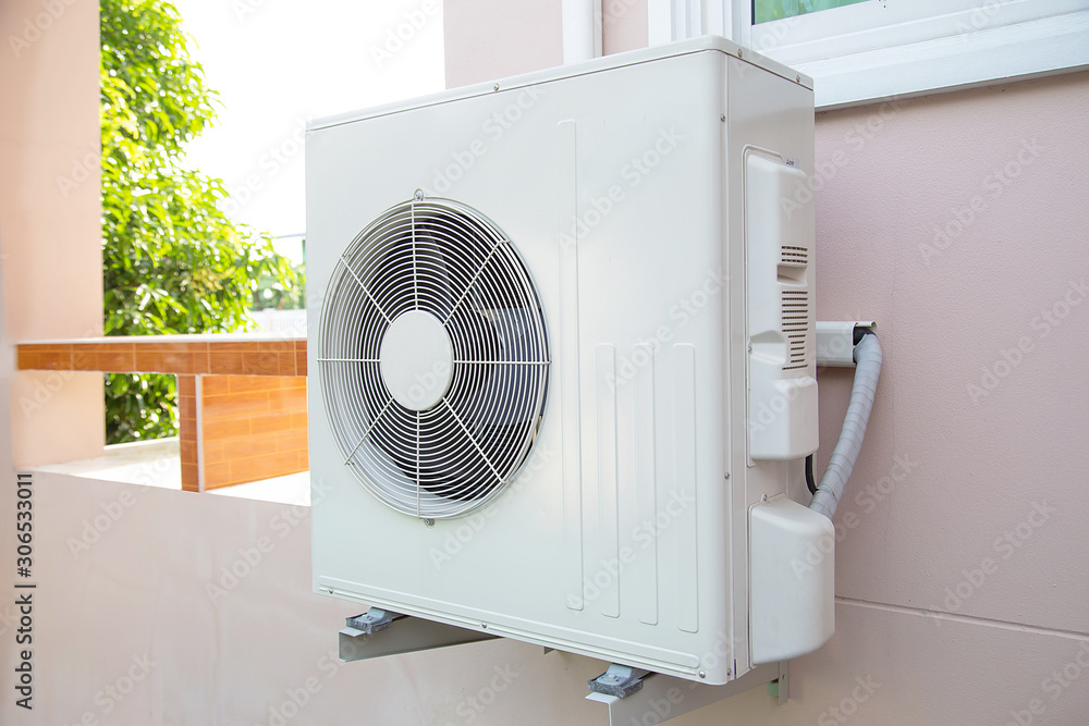 Air conditioner is installed outside the building. Air conditioner is installed outside the building.