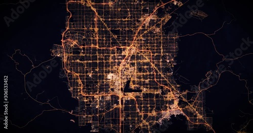 Aerial night view of city of Las Vegas, USA. Traffic and street light glowing. Camera flying high above, moving closer and rotating from space filming cinematic straight down. 3d animation rendering.