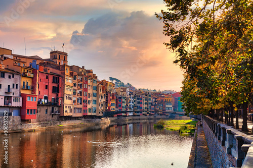 View of the Spanish city of Girona. Old Town, Sunset sky,.colorful houses and the Onyar river.
