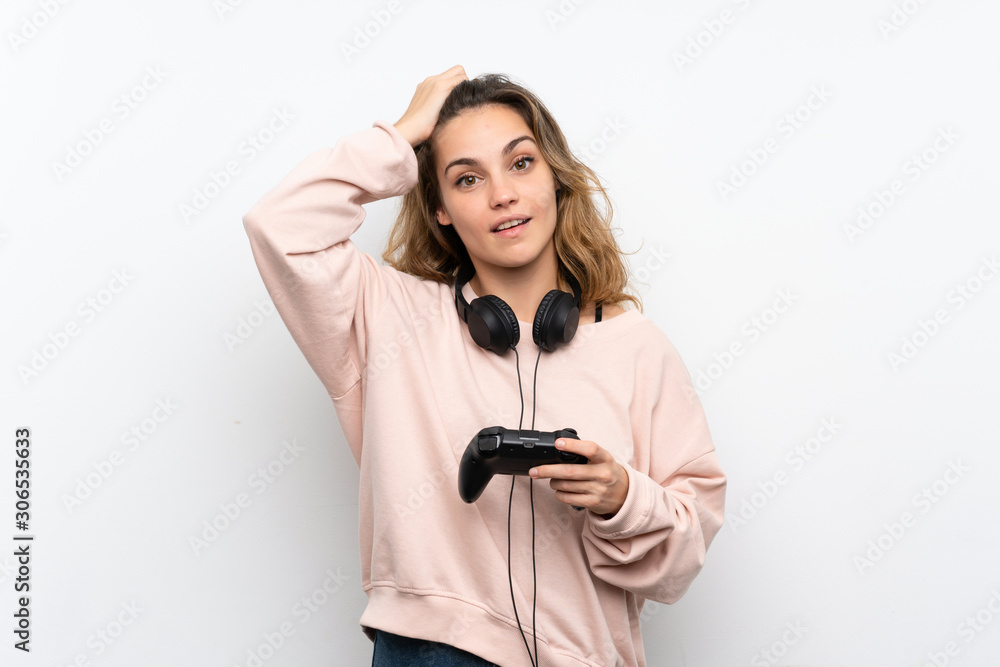 Young blonde woman playing at videogames Young blonde woman playing at videogames