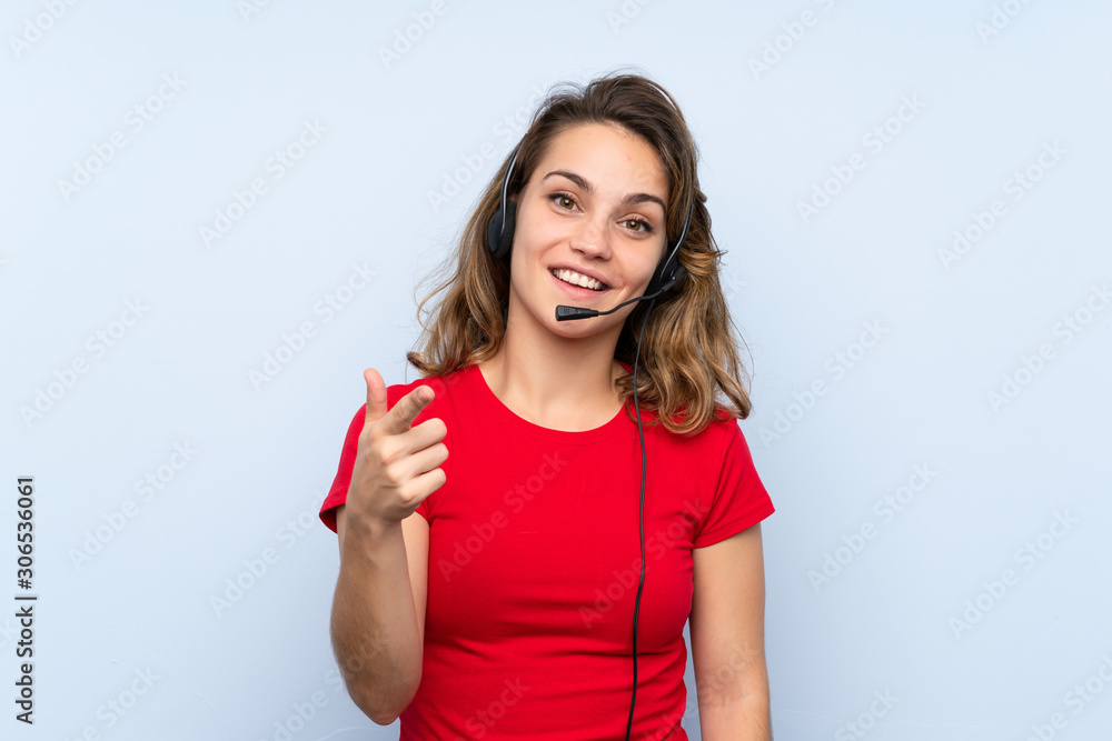 Young blonde woman pointing to the front Young blonde woman pointing to the front