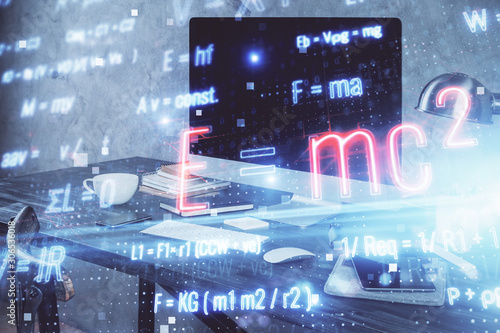 Desktop computer background and formula hologram writing. Double exposure. Education concept.