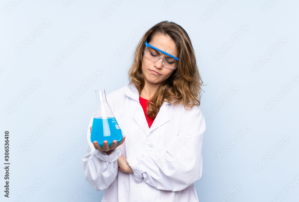 Young blonde woman with a scientific test tube Young blonde woman with a scientific test tube