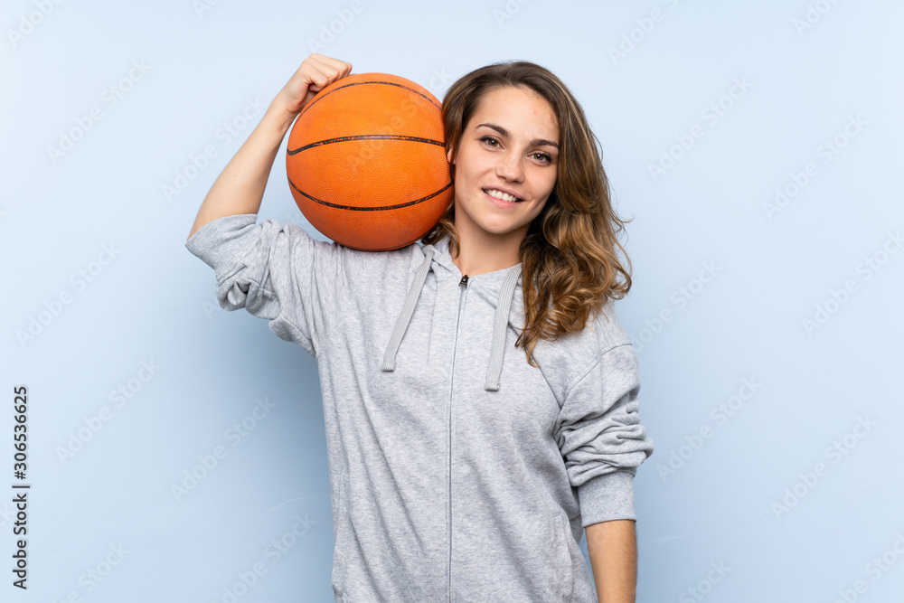 Young blonde woman with ball of basketball Young blonde woman with ball of basketball
