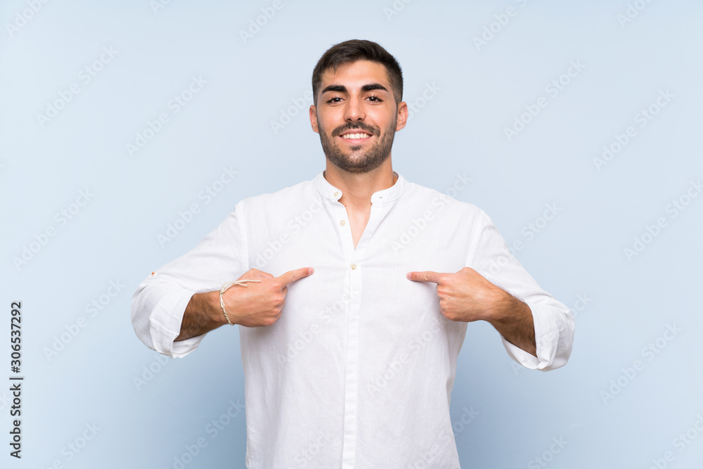 Handsome man with beard over isolated blue background with surprise facial expression Handsome man with beard over isolated blue background with surprise facial expression