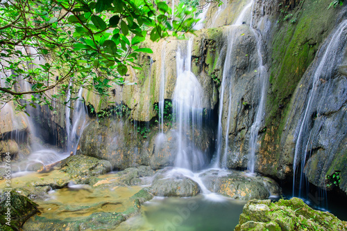 Mature trees and milky falls at Thac Voi waterfall  Thanh Hoa  Vietnam
