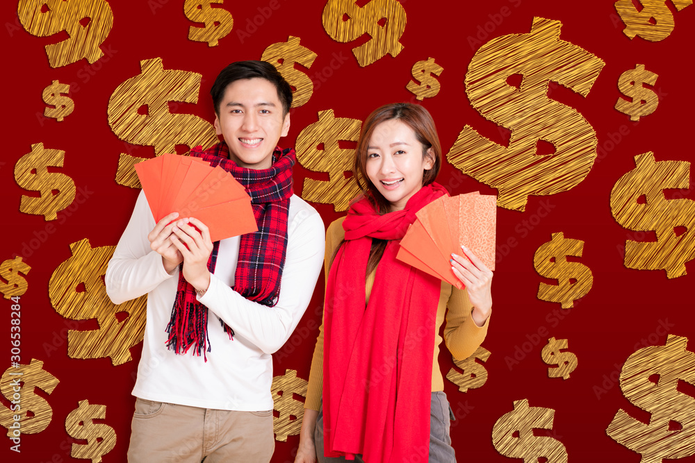 happy asian young couple celebrating  chinese new year