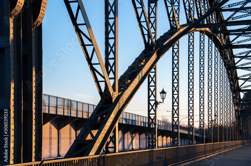 The old Harburger elbe bridge in a sunsetlight, a steel arch bridge connecting the Hamburg districts of Harburg and Wilhelmsburg via the southern Elbe. photo