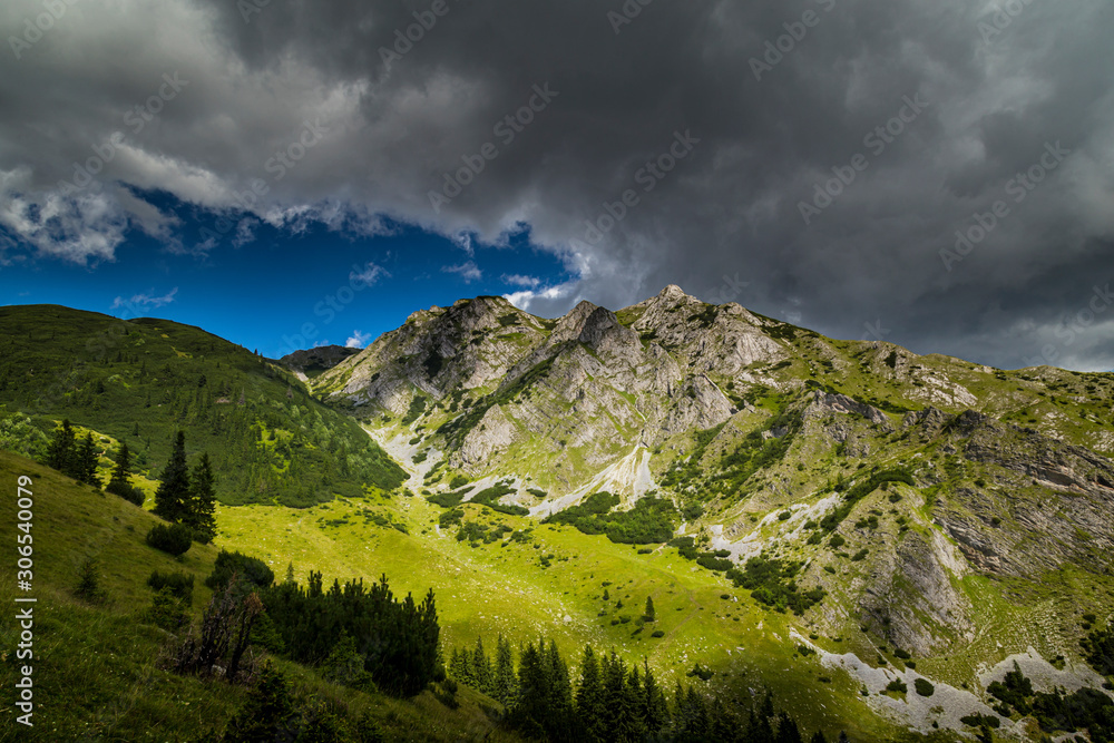 Beautiful mountain scenery in the Transylvanian Alps in summer, with storm clouds