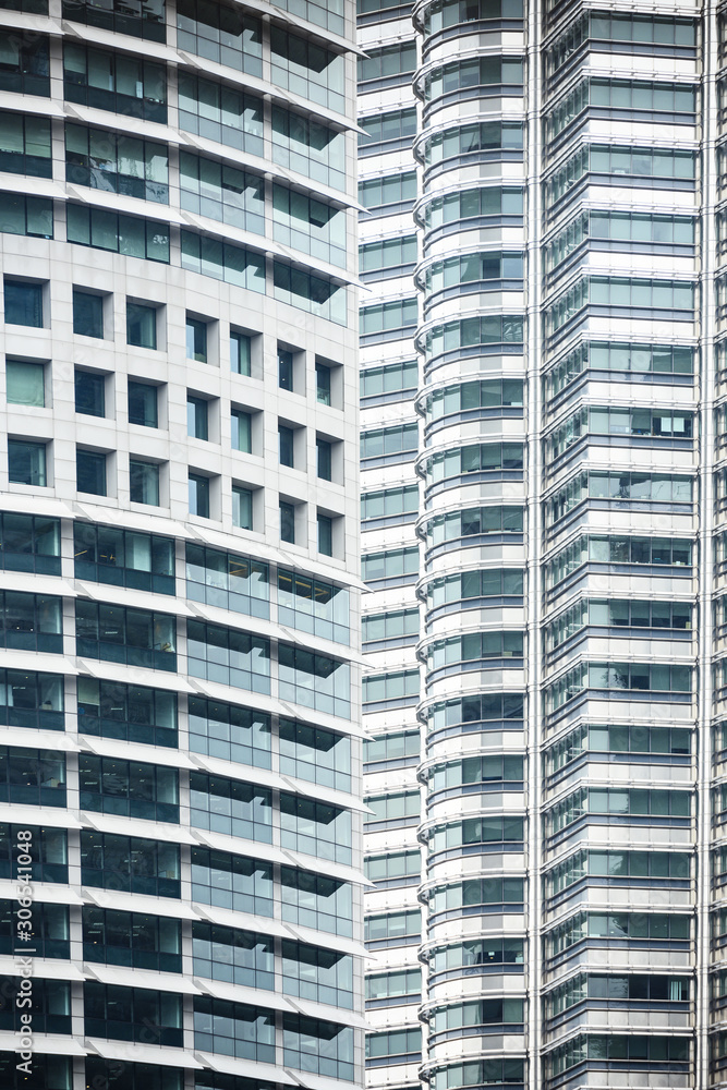 Close-up view of some modern and futuristic skyscrapers in Kuala Lumpur, Malaysia. Kuala Lumpur commonly known as KL, is the national capital of Malaysia. Close-up view of some modern and futuristic skyscrapers in Kuala Lumpur, Malaysia. Kuala Lumpur commonly known as KL, is the national capital of Malaysia.